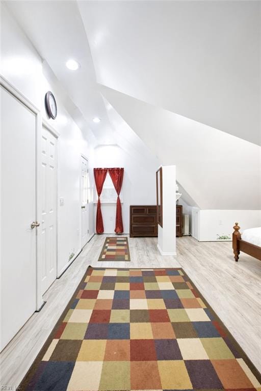 bonus room featuring recessed lighting, wood finished floors, and vaulted ceiling