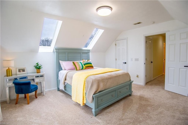 bedroom featuring vaulted ceiling with skylight, light colored carpet, visible vents, and baseboards