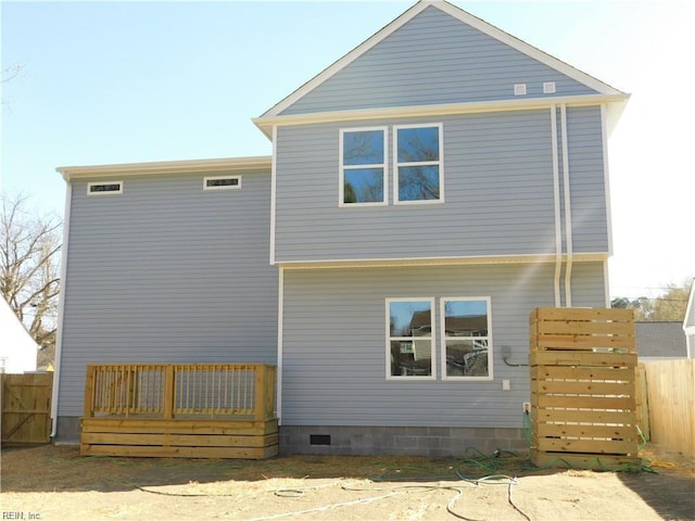 rear view of property with fence