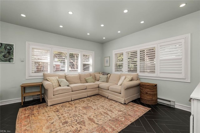 living room with baseboard heating, recessed lighting, and baseboards