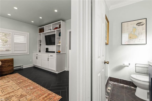 bathroom with baseboards, a baseboard radiator, recessed lighting, crown molding, and toilet