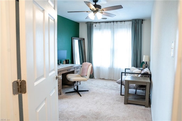 carpeted office with ceiling fan