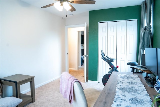 bedroom featuring a closet, carpet flooring, a ceiling fan, and baseboards