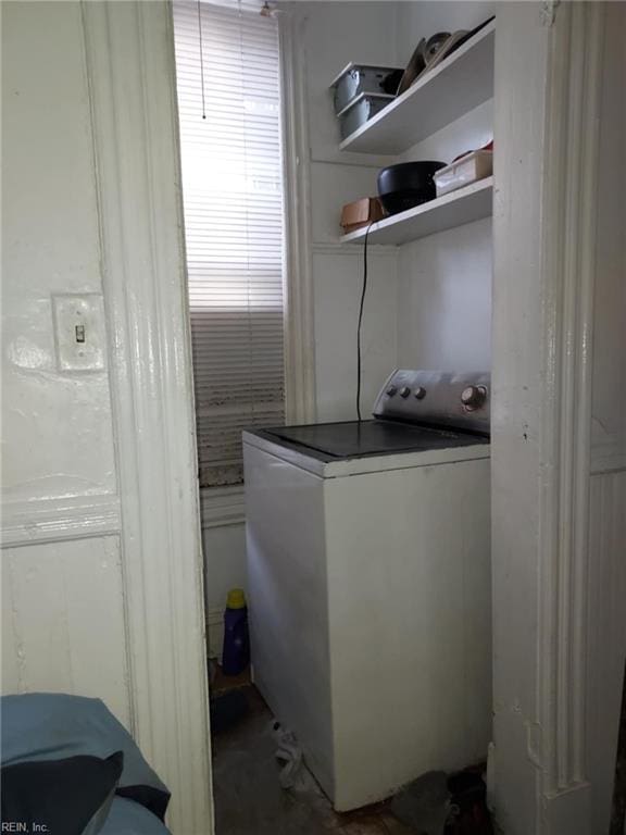 laundry area featuring washer / dryer and laundry area