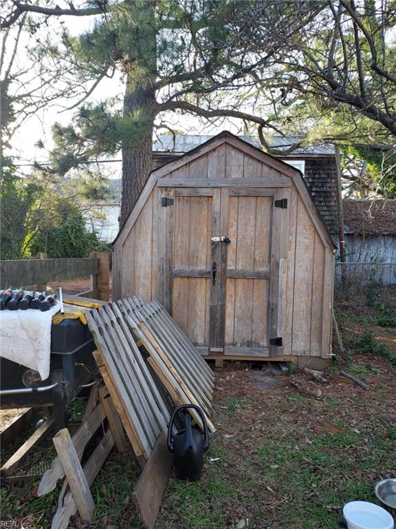 view of shed with fence