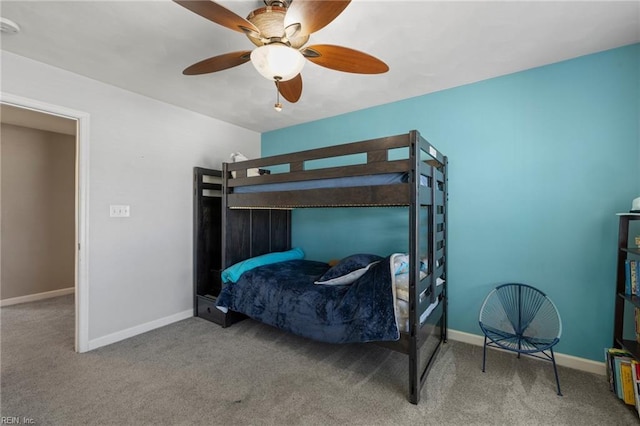 carpeted bedroom with baseboards and ceiling fan