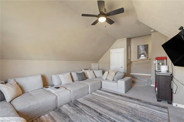 living area with visible vents, baseboards, vaulted ceiling, carpet floors, and a ceiling fan