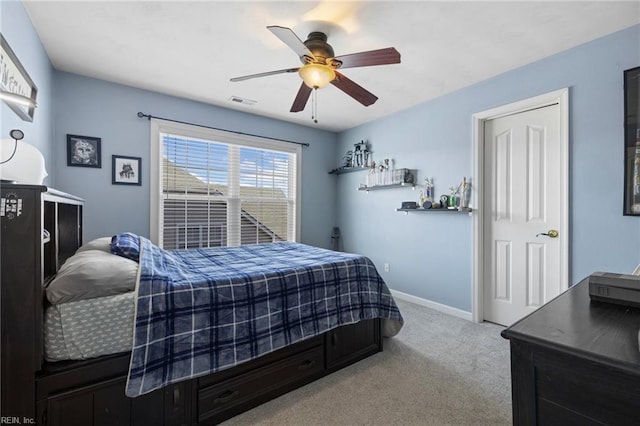 bedroom featuring ceiling fan, carpet, visible vents, and baseboards