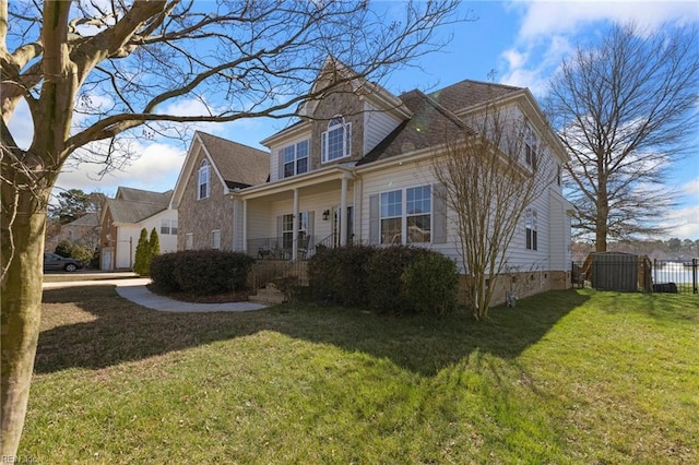 view of front of home featuring a gate, a front lawn, and fence