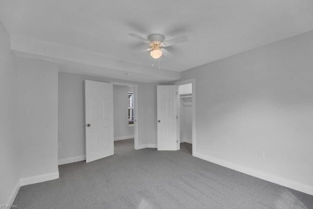 unfurnished bedroom with baseboards, a ceiling fan, and carpet flooring