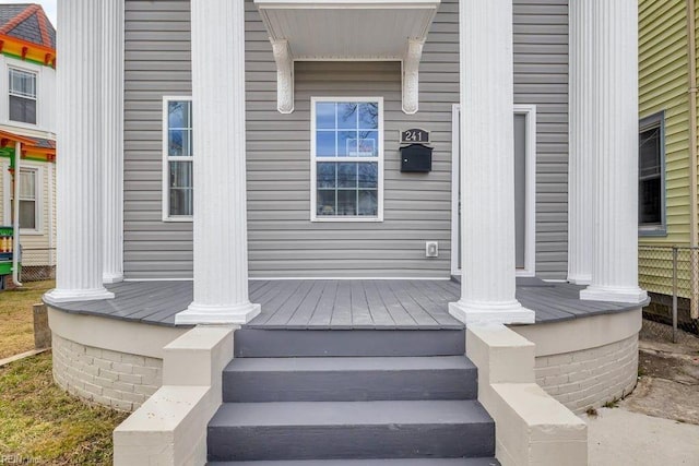 property entrance featuring covered porch