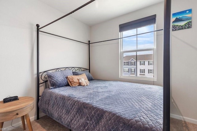 bedroom with carpet and baseboards