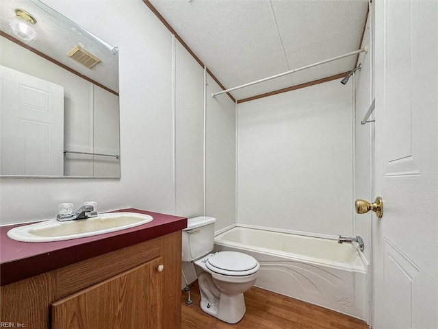 full bath with visible vents, toilet, shower / tub combination, wood finished floors, and vanity