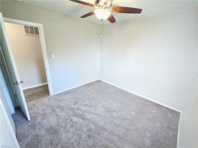 unfurnished bedroom with visible vents, carpet floors, baseboards, and a ceiling fan