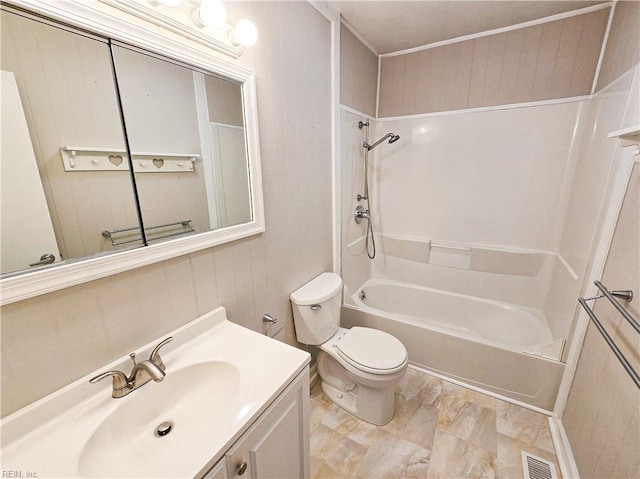 bathroom featuring visible vents, toilet, vanity, and bathtub / shower combination