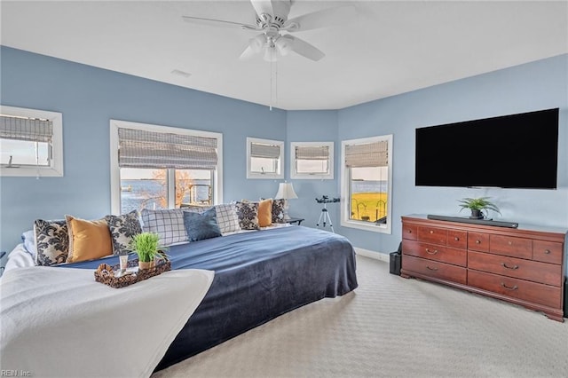 bedroom featuring carpet, baseboards, and ceiling fan