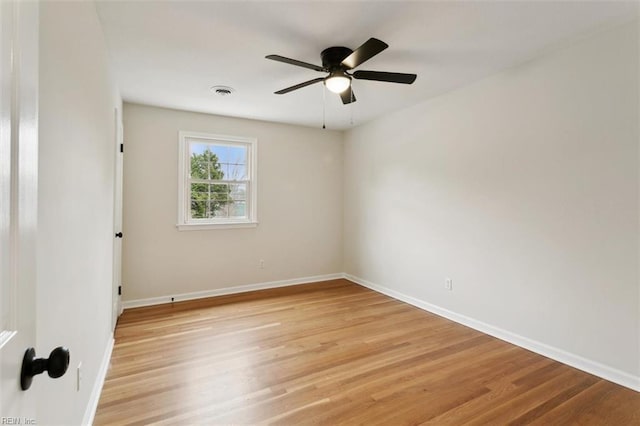 unfurnished room with visible vents, baseboards, and light wood finished floors