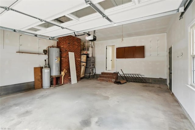 garage featuring a garage door opener and water heater