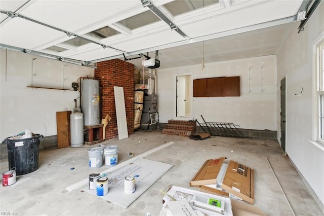 garage with a garage door opener and water heater