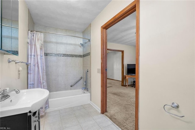 full bath with vanity, tile patterned floors, shower / bathtub combination with curtain, and baseboards