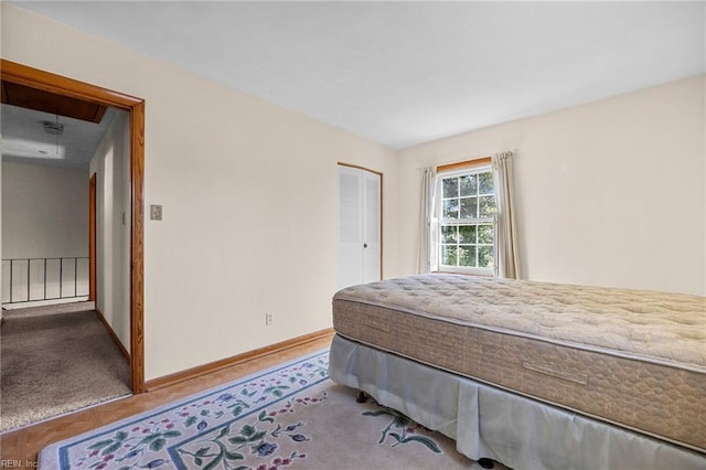 bedroom featuring a closet and baseboards