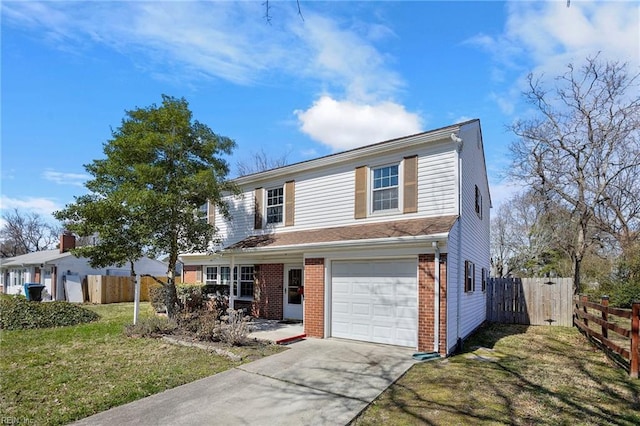 traditional-style home featuring fence, an attached garage, concrete driveway, a front lawn, and brick siding