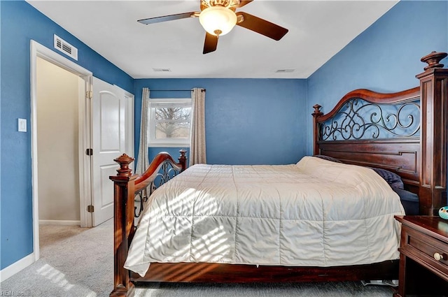 bedroom featuring ceiling fan, carpet, visible vents, and baseboards