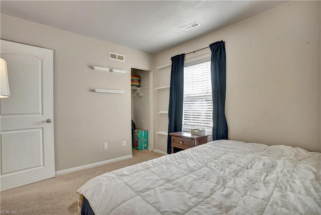 bedroom with visible vents, baseboards, and carpet