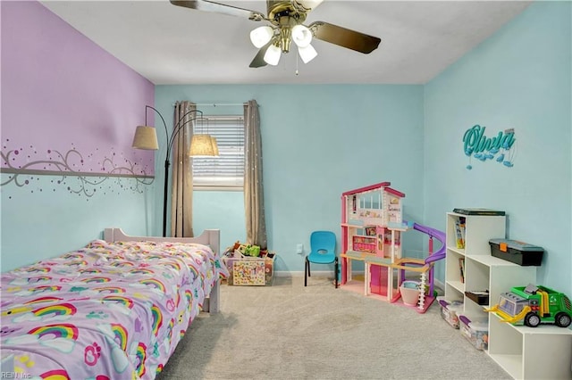 carpeted bedroom featuring baseboards and a ceiling fan