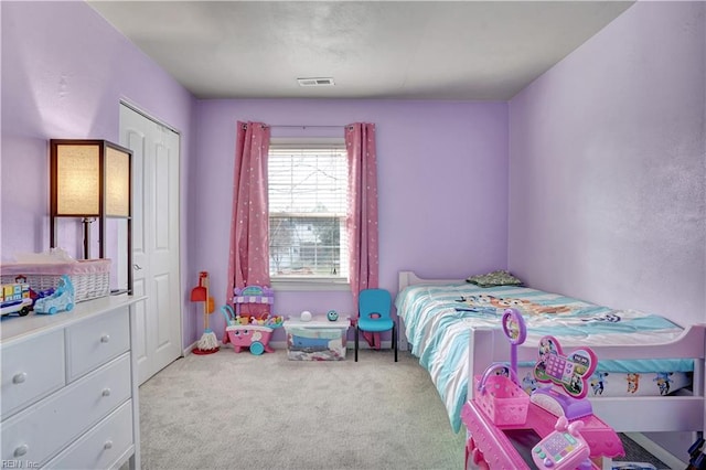 bedroom featuring carpet flooring and visible vents