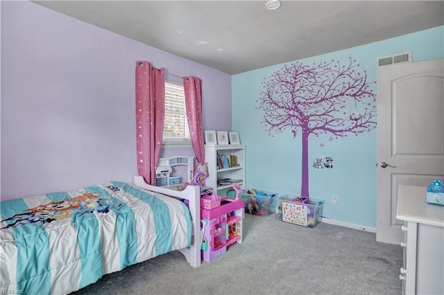 carpeted bedroom featuring visible vents