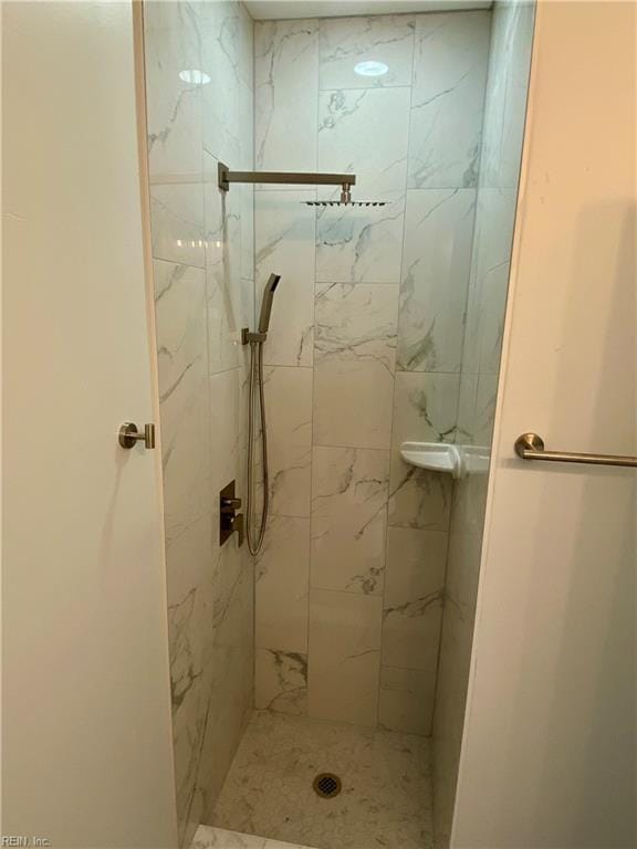 full bath with a shower stall