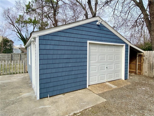 detached garage with fence