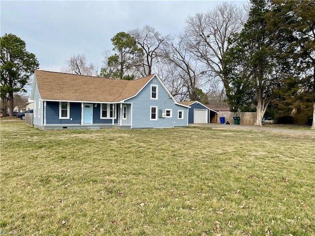 rear view of property with a porch, a yard, fence, and a garage