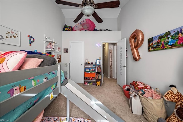 bedroom featuring ceiling fan, high vaulted ceiling, and carpet