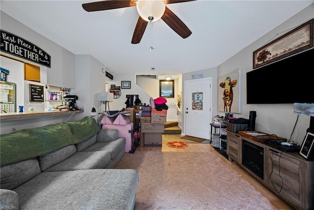 living room featuring ceiling fan and wood finished floors