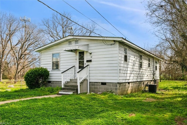 bungalow with a front yard, cooling unit, fence, and crawl space