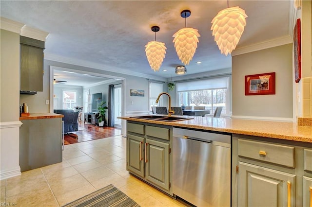 kitchen with stainless steel dishwasher, plenty of natural light, open floor plan, and a sink