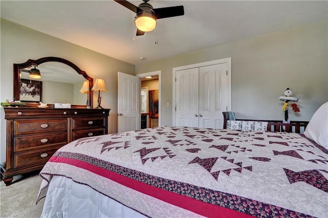 carpeted bedroom with a closet and a ceiling fan