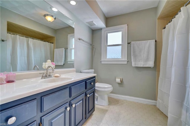 full bathroom with tile patterned flooring, visible vents, baseboards, toilet, and vanity