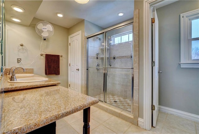 full bathroom with tile patterned floors, recessed lighting, baseboards, and a stall shower