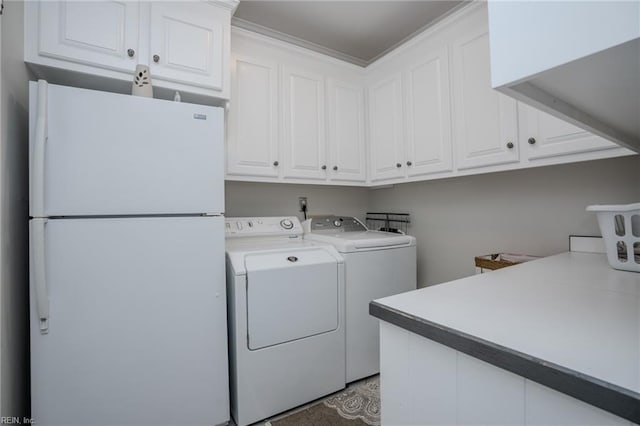 laundry room featuring cabinet space and independent washer and dryer