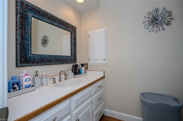 bathroom featuring baseboards and vanity