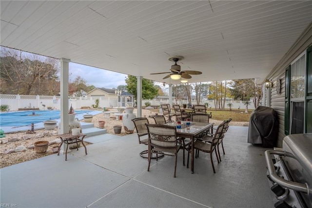 view of patio featuring a fenced in pool, ceiling fan, outdoor dining area, a fenced backyard, and a grill