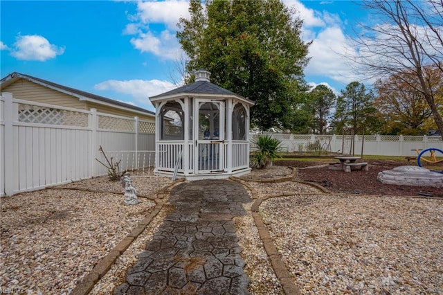 view of yard with a gazebo and a fenced backyard