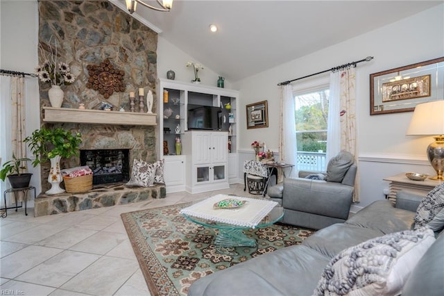 tiled living area featuring a fireplace and high vaulted ceiling