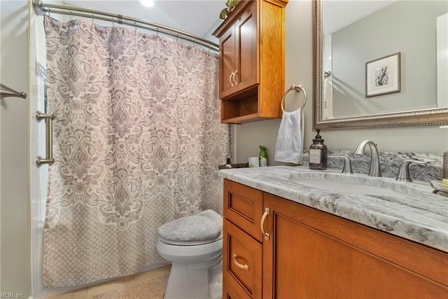 full bathroom featuring vanity, tile patterned floors, toilet, and a shower with curtain