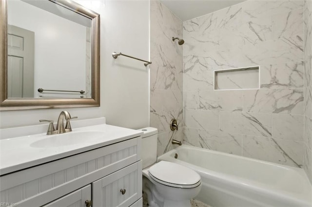 bathroom featuring toilet, vanity, and shower / tub combination