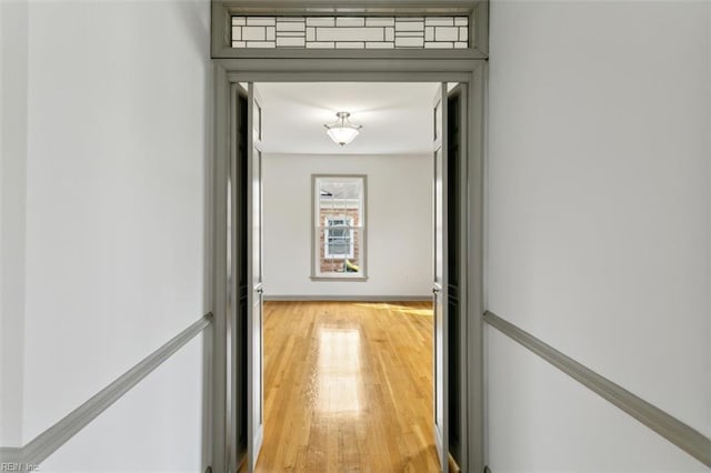 hall with light wood-style floors