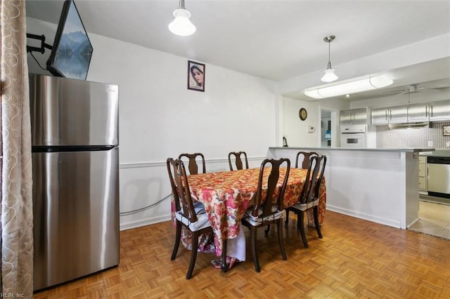 dining room with a ceiling fan